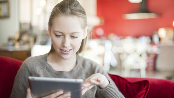 Toyota warranty woman on a tablet