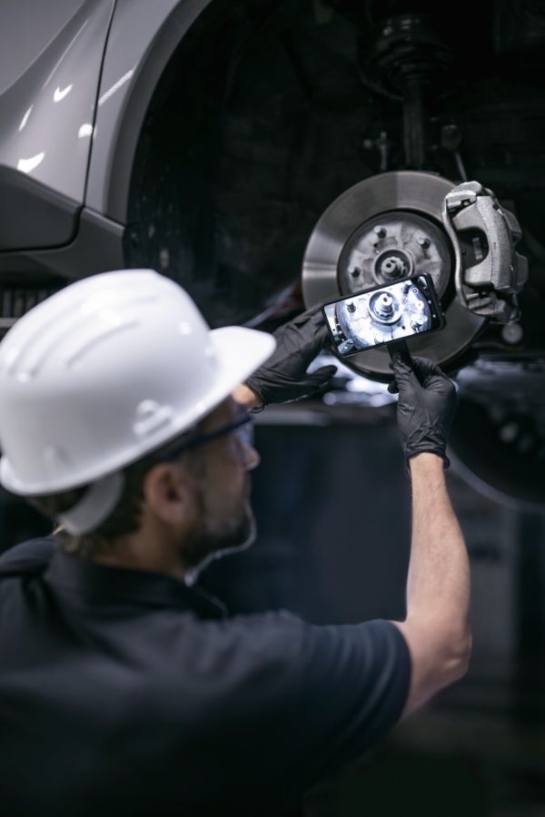 mechanic working on part of a Toyota car