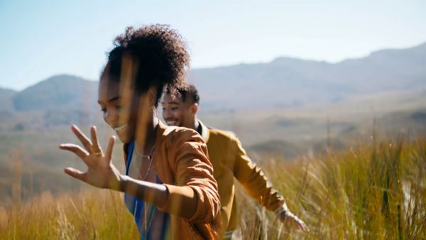 two people running through a field