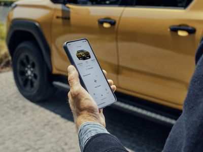 A Toyota Hilux owner checking their car status via the MyToyota app