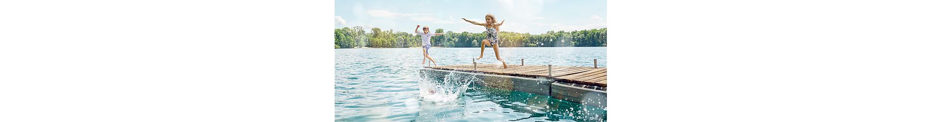 Children playing on a pier