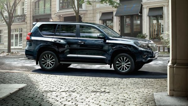 Toyota Land Cruiser parked in the road