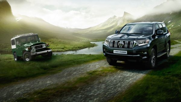 Toyota Land Cruiser parked next to a Toyota old car