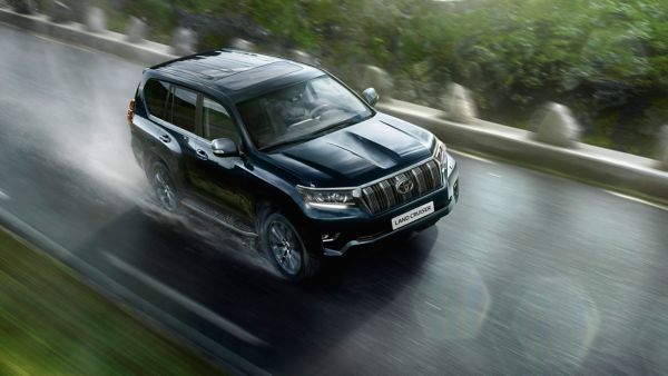 Toyota Land Cruiser driving along a road