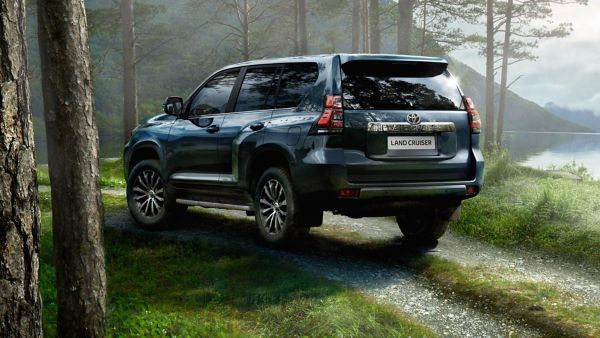 Toyota Land Cruiser parked in the woodland