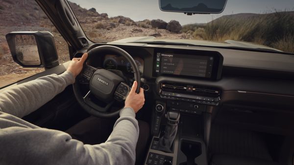 person driving a Land Cruiser