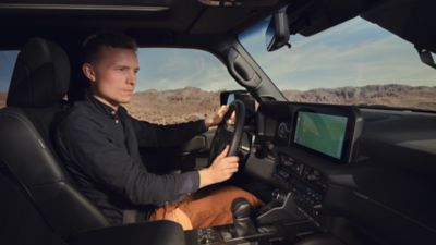 person driving a Land Cruiser
