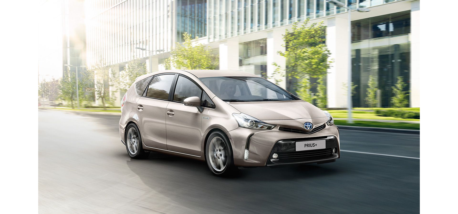 Toyota Prius+ driving along a road