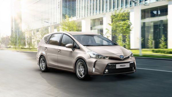 Toyota Prius+ driving along a road