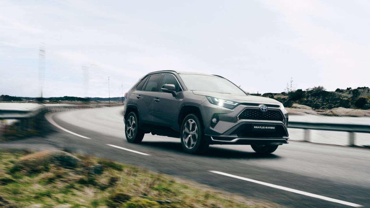 Toyota RAV4 PHEV driving down a road