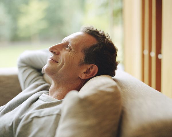 Man relaxing on sofa