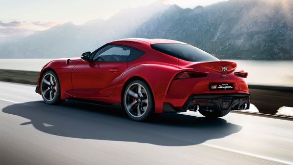 Toyota Supra driving along a road