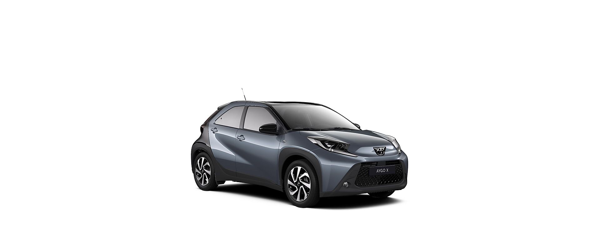 Ein dunkelgrauer Aygo X auf weißem Hintergrund