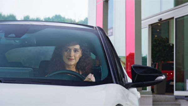 woman smiling while talking to someone for Toyota careers