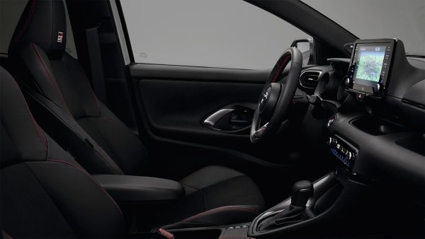 Model shown is Yaris GR SPORT  in bi-tone Dynamic Grey Night Sky Black roof (2RZ) and GR SPORT black fabric with red stitching seat