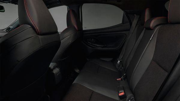 Model shown is Yaris GR SPORT  in bi-tone Dynamic Grey Night Sky Black roof (2RZ) and GR SPORT black fabric with red stitching seat