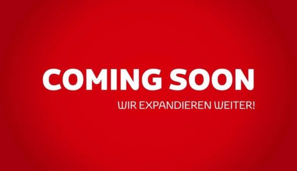 Ein roter Hintergrund mit einem weißen Schriftzug "COMING SOON. Wir expandieren weiter!"