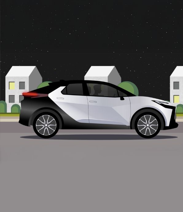 Grafika modelu Toyoty z napędem hybrydowym typu plug-in jadącego nocą.