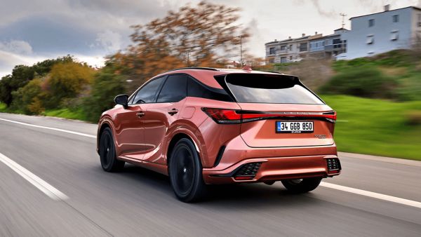 Lexus RX 450h+ driving on a road