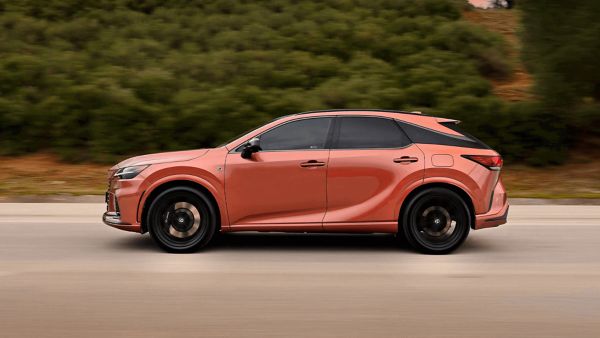 Lexus RX 450h+ driving on a road