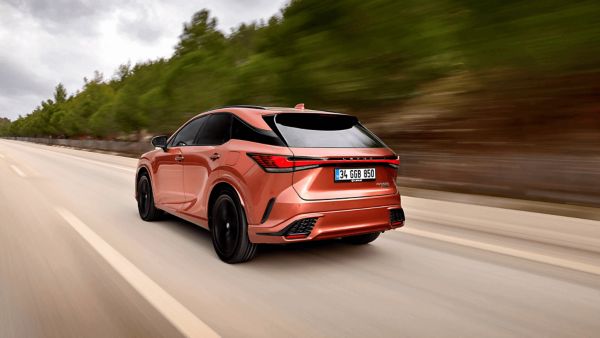 Side view of Lexus RX 450h+ driving