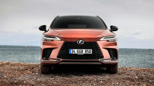 Lexus RX 450h+ plugged into a charging tower