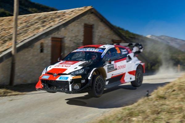 A rally car drifting in snow