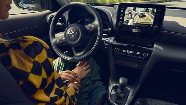 Toyota Yaris Cross with a passenger driving